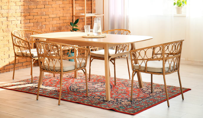 Woven rug under a dining table in a cozy room